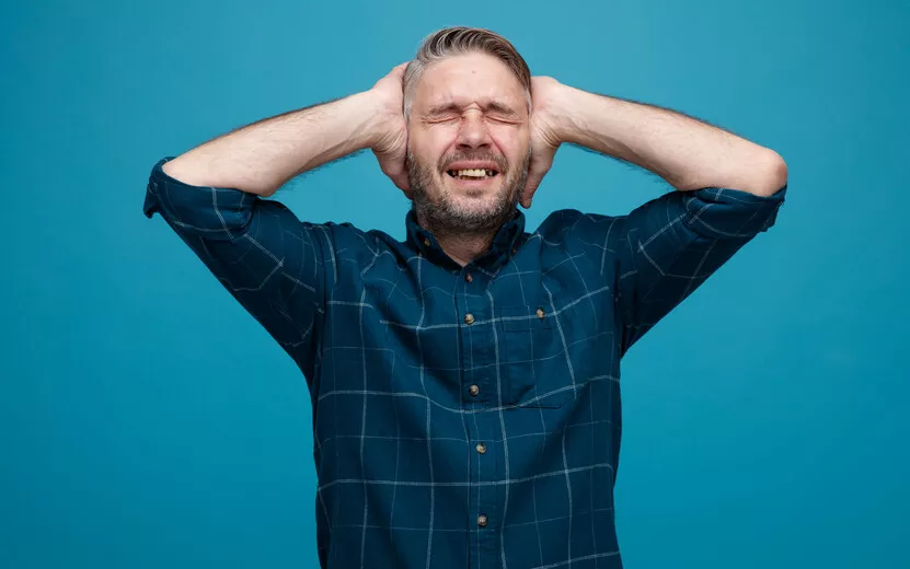 result_middle-age-man-with-grey-hair-dark-color-shirt-looking-annoyed-stressed-holding-hands-his-head-standing-blue-background.jpg