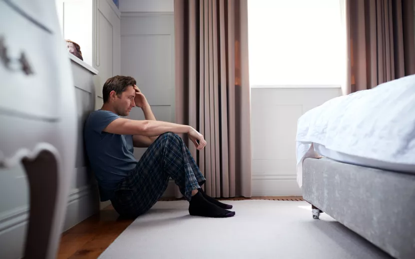 depressed-man-wearing-pajamas-sitting-on-floor-of-2023-11-27-05-36-08-utc (1).jpg