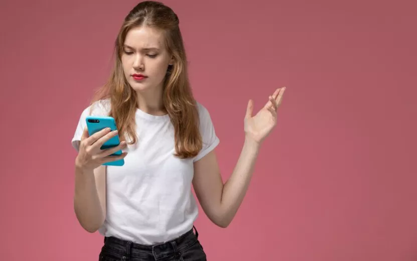 front-view-young-attractive-female-white-t-shirt-using-her-phone-pink-wall-model-color-female-young_140725-37899.jpg