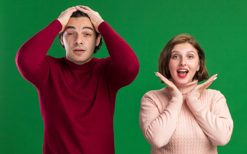 result_young-couple-valentine-s-day-concerned-man-keeping-hands-head-excited-woman-showing-empty-hands-chin-both-looking-front-isolated-green-wall.jpg