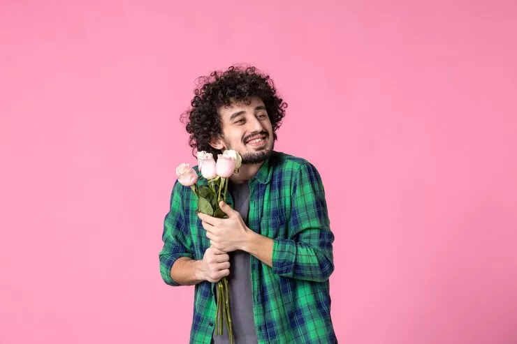 front-view-young-male-with-pink-roses-as-present-womens-day-pink-color_140725-146954.jpg