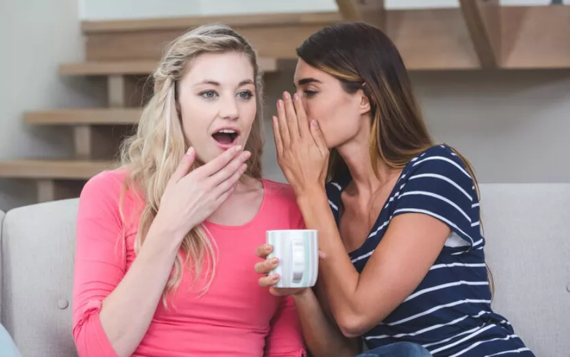 young-woman-whispering-secret-her-friend_107420-25684.jpg