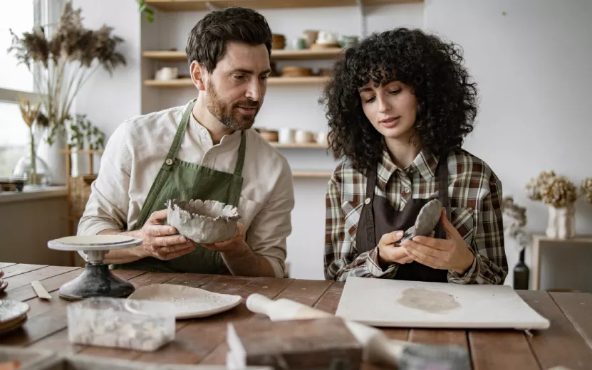 bearded-man-and-woman-sculpting-clay-pottery-toget-2024-06-03-20-13-22-utc.jpg