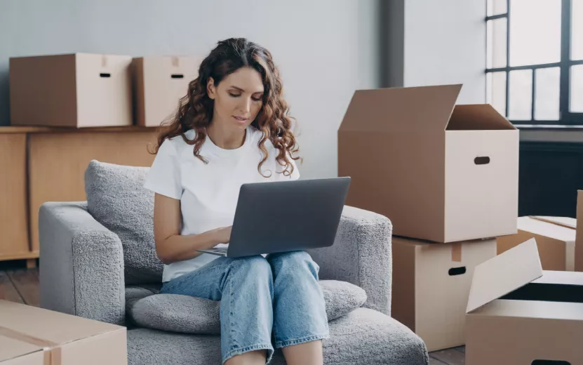 girl-shopping-online-for-new-house-at-laptop-sitt-2023-11-27-04-58-38-utc.jpg