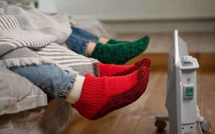close-up-feet-getting-warm-near-heater (1).jpg