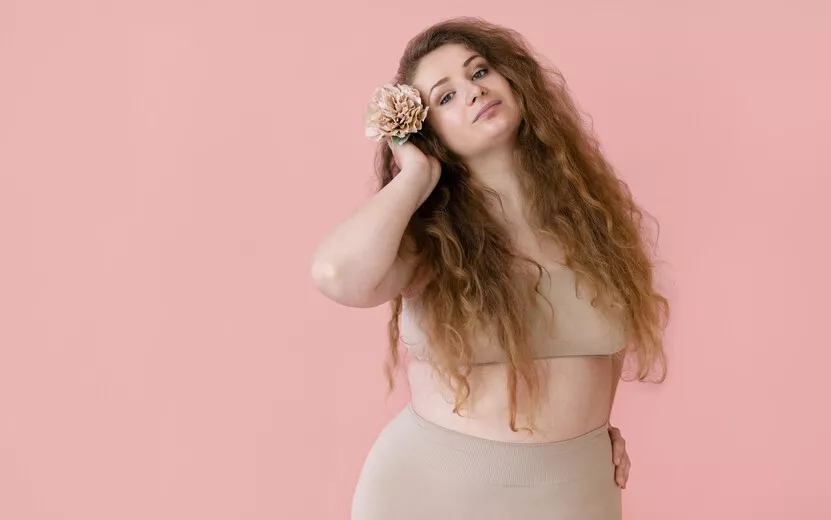 result_front-view-smiley-woman-posing-while-wearing-body-shaper-with-copy-space.jpg
