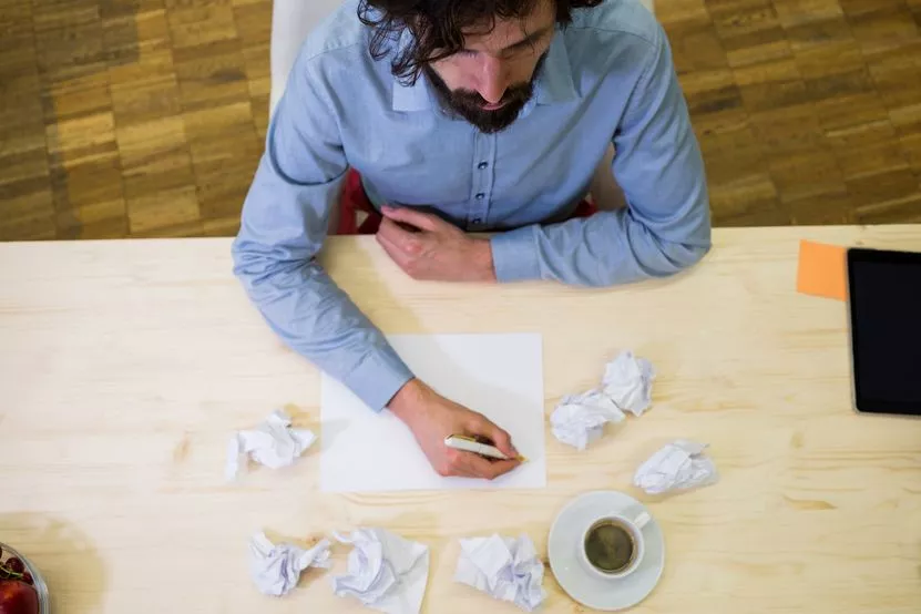 male-business-executive-writing-blank-paper.jpg male-business-executive-writing-blank-paper.jpg