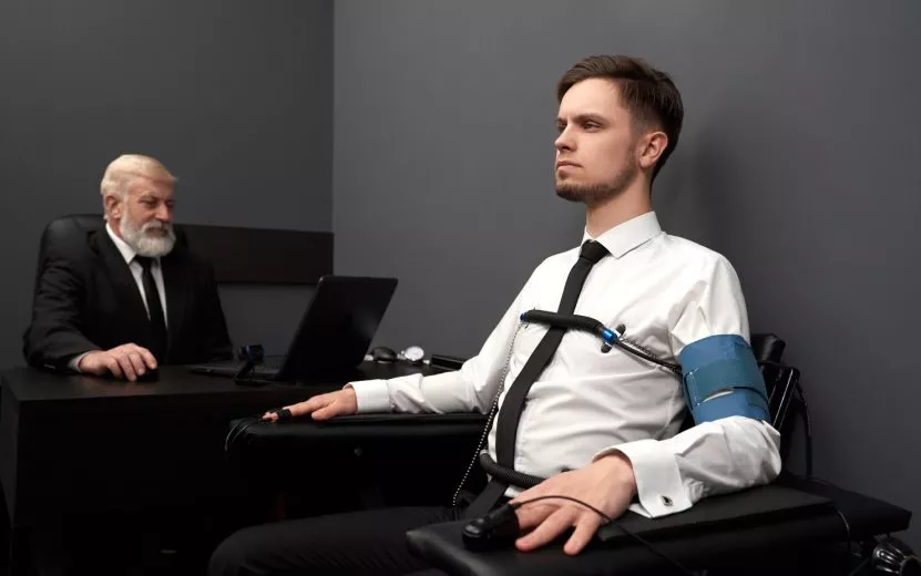 expert-examinating-young-man-with-lie-detector-2023-11-27-05-10-38-utc (4).jpg