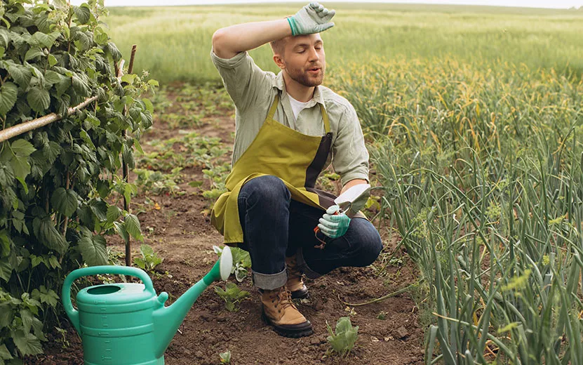 a-male-farmer-works-in-the-garden-and-shows-fatigu-2023-04-07-20-22-42-utc3.jpg