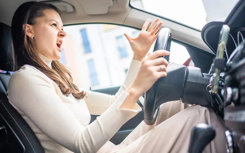 woman-driving-a-car-and-emo.jpg